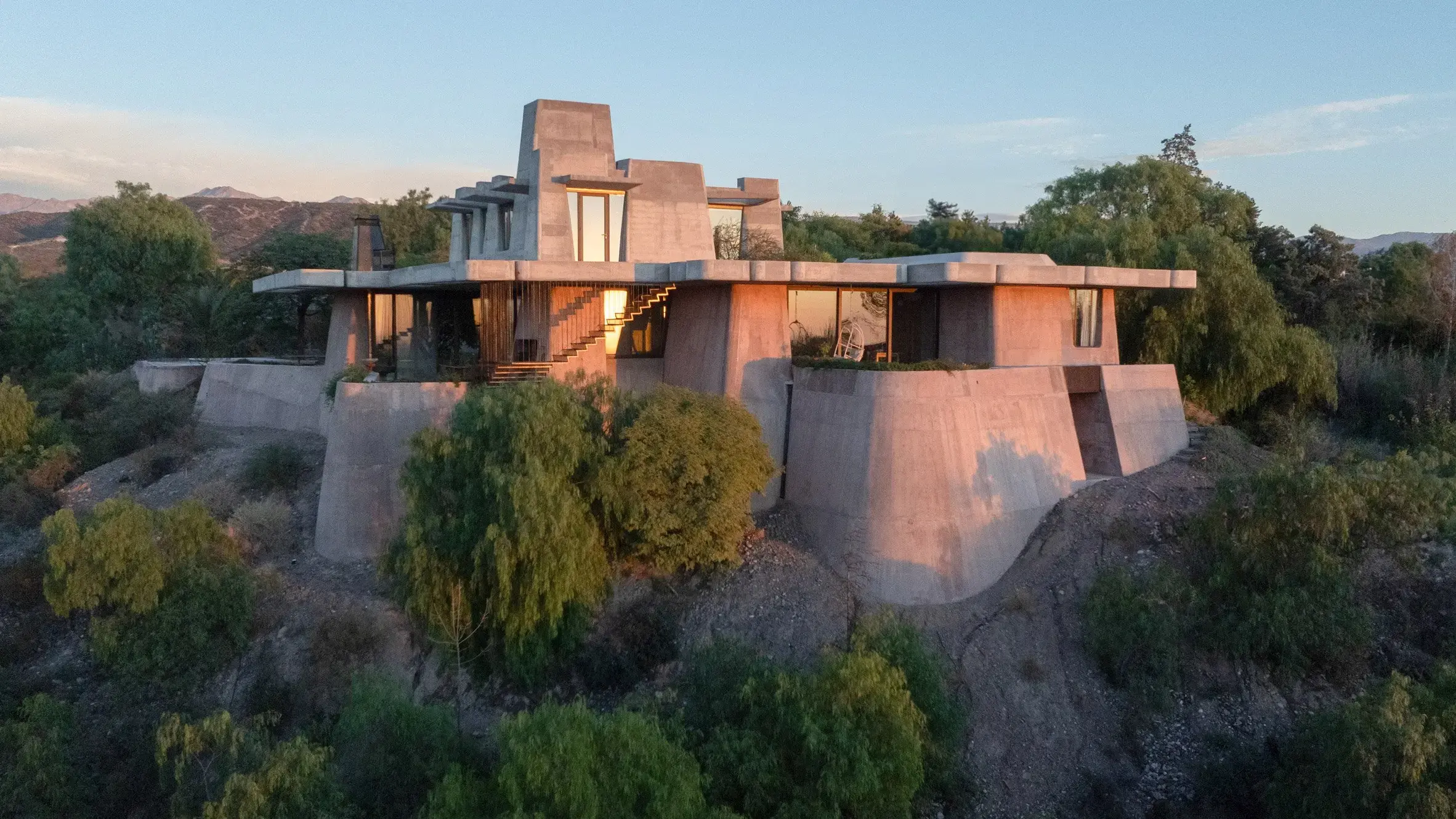 Modern mountain house exterior wide angle landscape shot